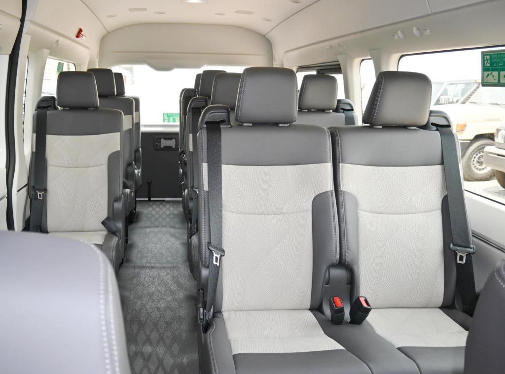 Rows of seats and the aisle inside a JATA Tours minibus