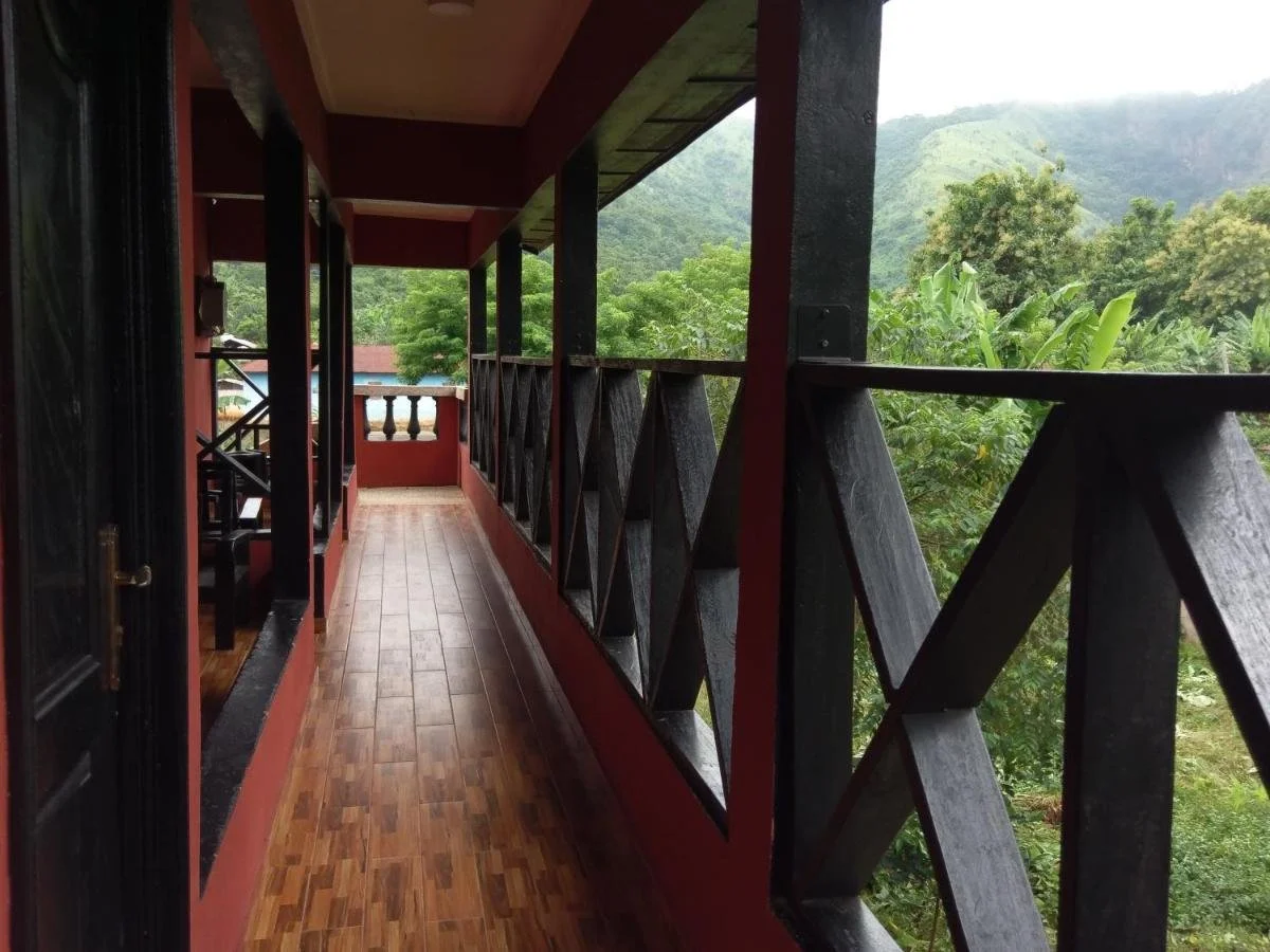 The timber veranda of the Bigfoot Safari Lodge looking out over the hills