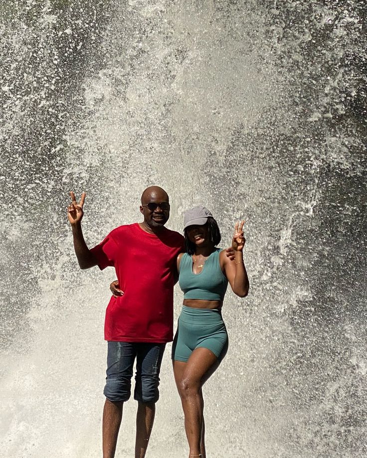 JATA Tours guests beneath a Ghanaian waterfall